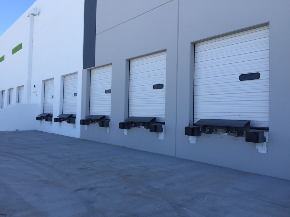 Row of commercial loading dock roll-up doors